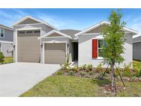 Charming single-Gathering home featuring a two-car garage and professionally landscaped front yard at 2007 Stetson Ave, Eagle Lake, FL 33839