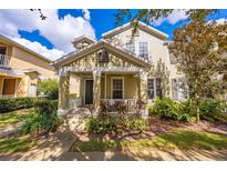 Charming two-story home with inviting front porch and well-manicured landscaping at 7127 Harmony Square S Dr # 7127, Harmony, FL 34773