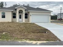 Newly constructed one-story home with attached garage and a spacious driveway at 1415 Orlando Way, Kissimmee, FL 34759