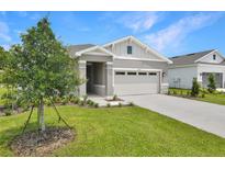 Charming single-story home with a two-car garage and well-manicured lawn at 4060 Bannock Ave, Tavares, FL 32778