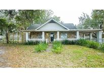 Charming stone and wood cottage with white picket fence at 8836 Sr 471 Hwy, Webster, FL 33597