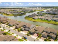 Beautiful aerial view of a neighborhood featuring houses and lakes at 2949 Nottel Dr, St Cloud, FL 34772