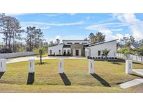 Modern home with stone accents and landscaped yard at 18802 Robertson St, Orlando, FL 32833