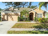 Charming single-story home with a well-manicured lawn and inviting curb appeal in a sunny neighborhood at 9650 Bay Pine Ln, Orlando, FL 32832