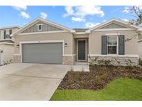 Beautiful single-Gathering home with a well-manicured lawn and a two-car garage at 1742 Carnelian St, Deland, FL 32720