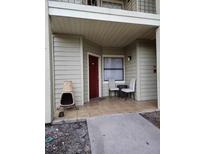 Inviting front patio with seating and a fire pit feature at 3016 Parkway Blvd # 109, Kissimmee, FL 34747