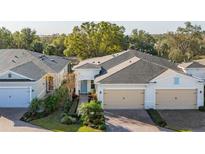 Two-story house with attached garage and walkway at 1867 Flora Pass Pl, Kissimmee, FL 34747