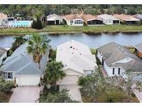 Aerial view of a single-Gathering home with water access and community amenities at 160 Rialto Rd, Poinciana, FL 34759