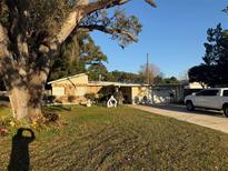 Ranch style home with mature landscaping and spacious yard at 4235 Edgewater Dr, Orlando, FL 32804