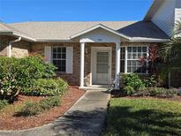 Brick front exterior of home with walkway and landscaping at 903 Illinois Ave, Saint Cloud, FL 34769