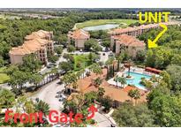 Aerial view of condo community, pool, and golf course at 1375 Tuscana Ln # 1106, Davenport, FL 33896