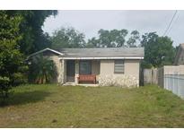 Ranch-style home with stone accents and a fenced yard at 22 S Observatory Dr, Orlando, FL 32835