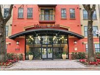 Uptown Place building entrance with landscaping and brick walkway at 911 N Orange Ave # 321, Orlando, FL 32801