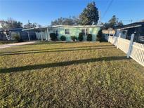 Ranch style home with carport and fenced yard at 1928 Beechwood Dr, Lakeland, FL 33803
