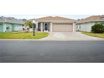 Single-story home with attached garage and landscaped yard at 580 Teesdale, Haines City, FL 33844