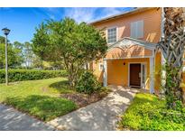 Inviting exterior of a two-story home with landscaping and walkway at 801 New Providence # B19/U801, Davenport, FL 33897