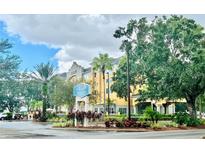 Hotel exterior with landscaping and signage at 3000 Maingate Ln # 209, Kissimmee, FL 34747