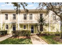 Attractive two-story townhome with a well-maintained front yard at 619 Founders Dr, Kissimmee, FL 34744
