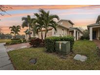 Two-story house with a two-car garage and landscaped yard at 2451 Datura Loop, St Cloud, FL 34772