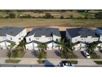 An aerial view of townhomes overlooking the community golf course at 853 Ocean Course Ave # 853, Davenport, FL 33896