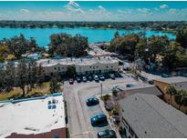 Aerial view of a multi-Gathering residence by the water with community pool and convenient parking at 768 E Michigan St # 75, Orlando, FL 32806