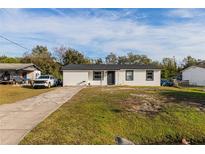 Newly renovated home with a white exterior and black accents at 2959 Old Dixie Hwy, Kissimmee, FL 34744