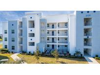 Modern building exterior, featuring light blue and white accents at 3131 Paradox Cir # 401, Kissimmee, FL 34746