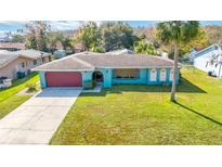 Ranch-style home with carport and spacious yard at 508 Bar Dr, Kissimmee, FL 34759