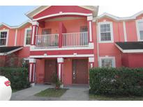 Charming townhome featuring a private balcony and well-maintained front yard at 261 Autumn Ln # 4, Kissimmee, FL 34743