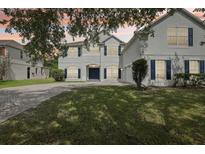 Beautiful two story home featuring manicured front lawn and brick paved driveway, with two car garage at 3209 Eagle Watch Dr, Kissimmee, FL 34746