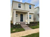 Two-story home with a welcoming front porch and well-maintained landscaping at 12638 Clear Shapphire Drive, Winter Garden, FL 34787