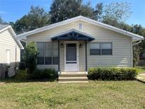 Charming single-story home with a well-manicured lawn, inviting entrance, and delightful curb appeal at 521 Tennessee Ave, St Cloud, FL 34769