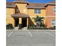 Beautiful townhome with lush landscaping and reserved parking in a desirable community at 8961 California Palm Rd, Kissimmee, FL 34747