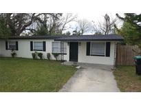 Charming single-story home featuring a well-maintained lawn and a freshly painted exterior at 2411 Nansen Ave, Orlando, FL 32817