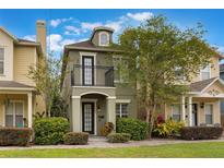 Charming two-story home with a balcony, manicured landscaping, and a welcoming front entrance at 1545 Indiana Ave # B, Winter Park, FL 32789