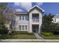 Charming two-story home with a well-manicured front yard and inviting entrance at 7973 Greengard St, Orlando, FL 32827