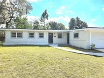 Charming single-story home with a well-maintained front lawn and inviting entrance at 5804 Viking Rd, Orlando, FL 32808