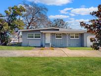 Charming single-story home featuring a well-maintained lawn and a quaint, welcoming entrance at 1921 N Forsyth Rd, Orlando, FL 32807