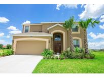 Charming two-story home featuring a neutral color palette, attached two-car garage, and well-manicured landscaping at 2292 Crofton Ave, Davenport, FL 33837