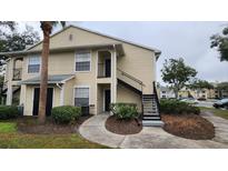 Charming multi-Gathering home with classic siding, inviting entryway, and well-maintained landscaping at 1073 S Hiawassee Rd # 1011, Orlando, FL 32835