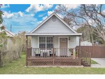 Charming home featuring a cozy front porch perfect for relaxing outdoors at 1518 Ohio Ave, St Cloud, FL 34769