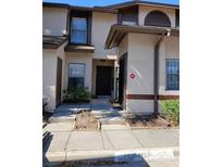 Charming townhome with a well-maintained facade and inviting entrance at 2900 S Semoran Blvd # S, Orlando, FL 32822