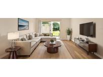 Inviting living room features contemporary furnishings and bright sliding glass doors at 1695 Lee Rd # E103, Winter Park, FL 32789