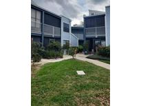 Beautiful two-story condo unit featuring a charming exterior and well-maintained landscaping at 3775 Atrium Dr # 3, Orlando, FL 32822