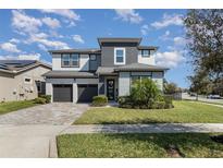 Beautiful two-story home with well-maintained lawn and two car garage at 16694 Olive Hill Dr, Winter Garden, FL 34787