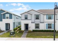 Charming two-story townhome with well-manicured landscaping and a welcoming front entrance at 281 Jetty Way, Davenport, FL 33897