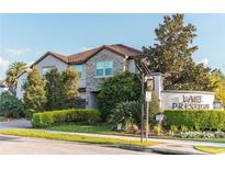 Beautiful two-story home in Lake Preserve with stone accents and lush landscaping at 3100 Stonewyck St, Orlando, FL 32824