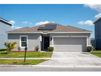 Charming single Gathering home with well-maintained lawn and solar panels on the roof at 1228 Haines Dr, Winter Haven, FL 33881