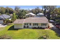 Charming single-story home with a well-maintained lawn and inviting curb appeal at 401 Woodlawn Ter, Kissimmee, FL 34744