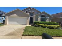Charming single-Gathering home with well-maintained landscaping and a two-car garage at 8122 Yellow Crane Dr, Kissimmee, FL 34747